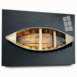 Side view of a rowboat depicted in muted blue and gray tones on a large acrylic print.