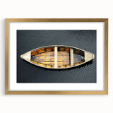 Textured art print of an abstract rowboat in muted blue and gray tones on a framed canvas, ideal for bedroom wall decor.