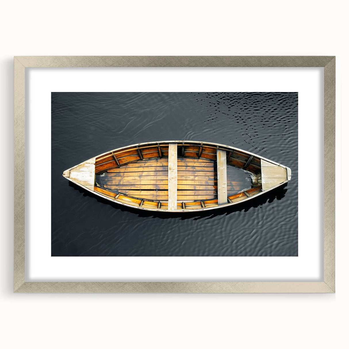 Abstract art print of a rowboat in muted blue tones on a framed canvas, suitable for dining room decor.