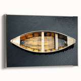 Vintage poster art of a rowboat in muted black and colorful accents on a framed canvas, ideal for living room decor.