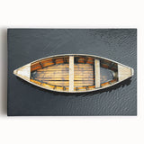 Black and white photo of a rowboat on calm waters printed on large stretched canvas, suitable for kitchen wall art.