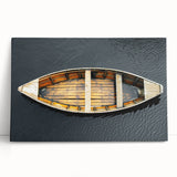 Black and white photo of a rowboat on calm water, printed on large stretched canvas, ideal for kitchen wall art.