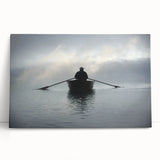 Black and white photo of a rowboat on calm water, printed on large stretched canvas.