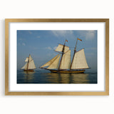 Textured abstract art print of a sailboat in muted blue and white, framed in gold, ideal for bedroom decor.