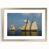 Abstract art print of a sailboat in muted blues and grays on a framed canvas, ideal for dining room decor.