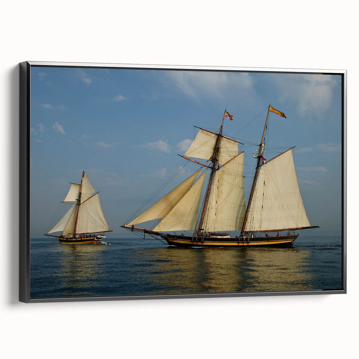 Black and white framed canvas depicting a vintage sailboat on the ocean, suited for bedroom wall decor.