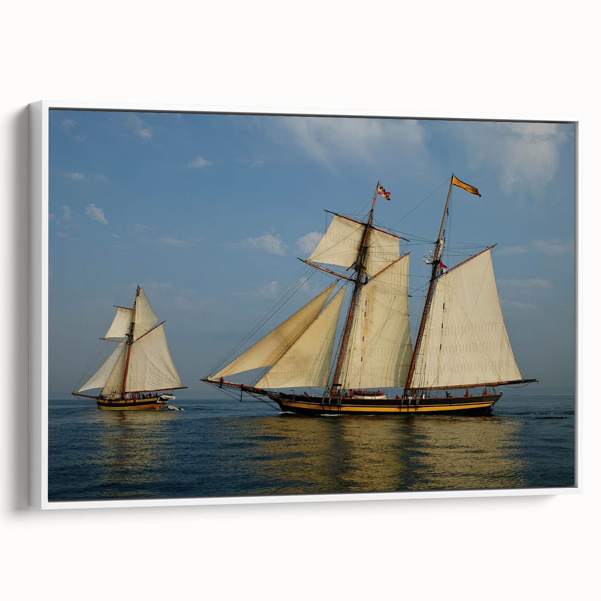 Framed canvas featuring a vintage sailboat on a muted black seascape, ideal for bedroom wall art.