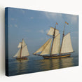 Sailboat on calm waters depicted in muted blue and white tones on a stretched canvas, suitable for kitchen wall decor.