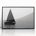 Large abstract wall art of a sailboat, in muted blue and white tones on a black framed acrylic.