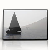 Large abstract wall art of a sailboat, in muted blue and white tones on a black framed acrylic.