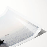 Extra large wall art featuring a sailboat with vibrant blue and white tones on a rolled print.