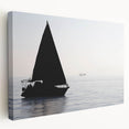 Sailboat on calm waters depicted in muted blue and white tones on stretched canvas, suitable for kitchen wall art.