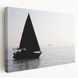 Sailboat on calm waters depicted in muted blue and white tones on stretched canvas, suitable for kitchen wall art.