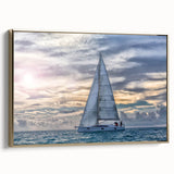 Framed canvas of a vintage sailboat on a colorful sea, ideal for nautical-themed decor.