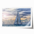 Rolled print of a sailboat on calm waters in muted blue and white hues, ideal for dining room wall art.
