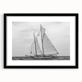 Abstract art print featuring a colorful, textured depiction of sailboats, framed in black.