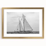 Textured abstract art print of a sailboat, using a palette of blue and white, framed in gold, suitable for bedroom art.