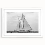 Abstract art print of a sailboat in textured blue and white tones on a framed canvas, ideal for living room decor.