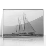 Framed acrylic print of a mid-century modernist style sailboat, in muted blue and white tones.