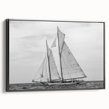 Black and white framed canvas featuring a vintage sailboat on calm waters, ideal for bedroom wall decor.