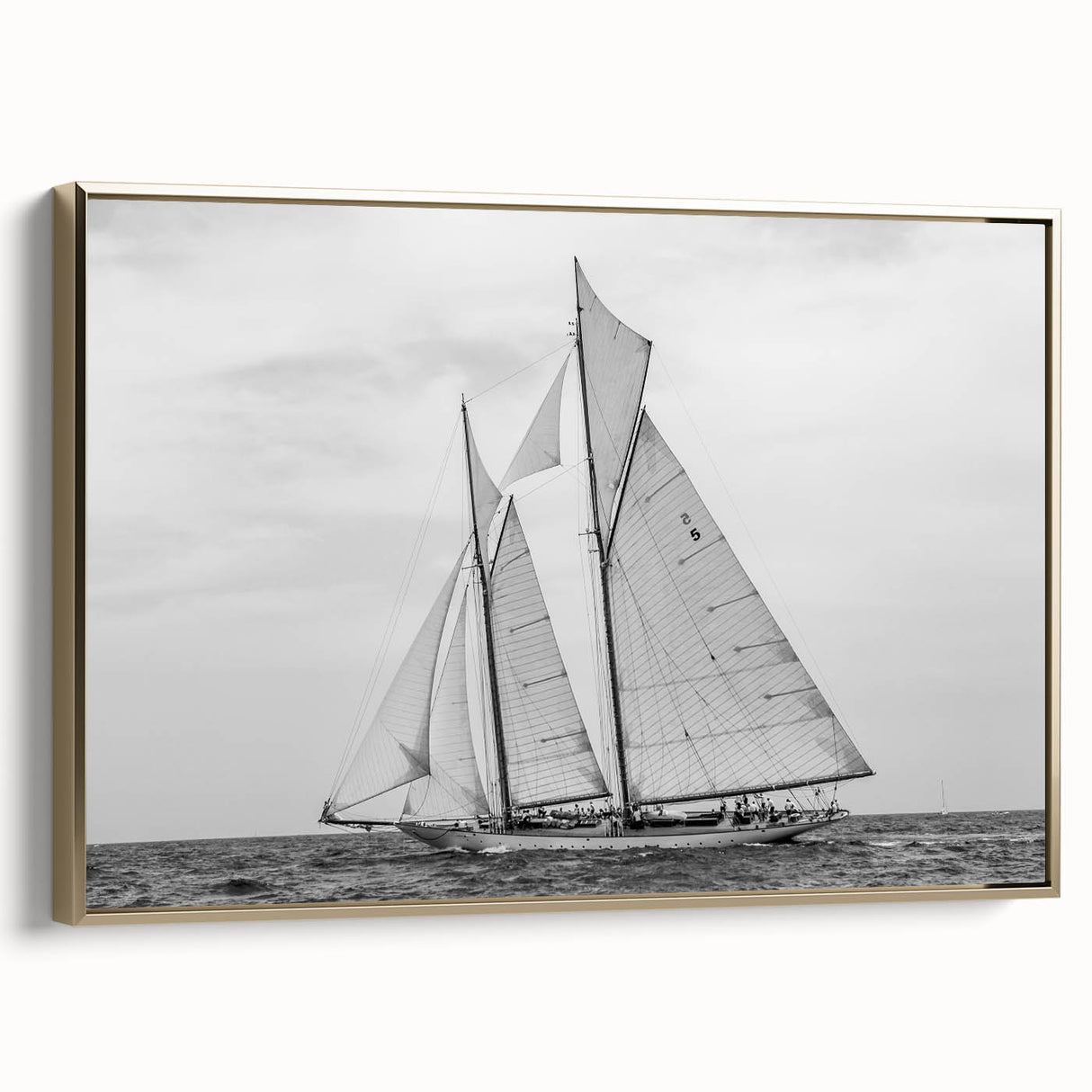 Framed canvas featuring a vintage sailboat on a colorful seascape, ideal for adding character to a living room.