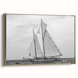 Framed canvas featuring a vintage sailboat on a colorful seascape, ideal for adding character to a living room.