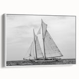 Framed canvas featuring a vintage sailboat on a muted black and gray seascape, ideal for bedroom wall art.