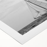 Art deco style poster of a sailboat on rolled canvas, featuring neutral and blue tones, suitable for dining room wall art.