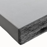 Black and white large art depicting a sailboat on serene waters, printed on stretched canvas.