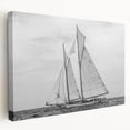 Sailboat on a calm sea depicted in soft blue and white tones on a stretched canvas, suitable for kitchen wall art.