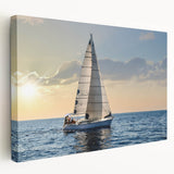 Sailboat on open water depicted in muted blue tones on a large stretched canvas, ideal for kitchen wall art.