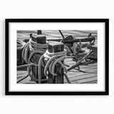 Abstract art print of a colorful sailboat on textured canvas, framed in black, ideal for living room decor.