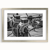 Abstract art print of a sailboat in muted blue and white tones on a framed canvas, ideal for dining room decor.