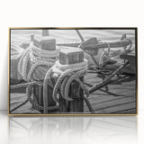 Mid-century modernist art depicting a sailboat, rendered in muted blue and white tones on a gold-framed acrylic print.