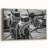 Framed canvas featuring a vintage poster of a colorful sailboat on a black background.