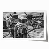 Rolled print of a sailboat on calm waters in soft blue and white tones, suitable for art wall dining room.