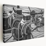 Sailboat on a calm sea depicted in muted blues and grays on a stretched canvas, suitable for kitchen wall art.