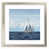 Abstract art print of a sailboat in muted blue and white tones on a framed silver mat.