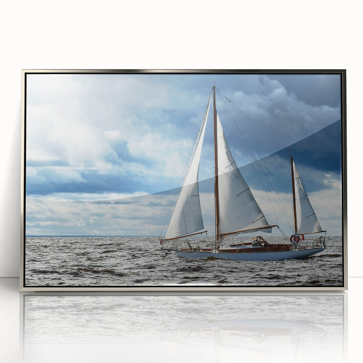 Art deco style sailboat on calm waters, silver-framed acrylic print, ideal for modern art wall decor in a nursery.