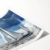 Extra large wall art featuring a sailboat on a muted blue and white sea, printed on rolled canvas.