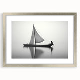 Abstract art print of a stylized sailboat in cool blue and white tones, framed in silver.