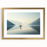 Textured abstract art print of a sailboat in muted blues and whites, framed in gold, suitable for bedroom decor.