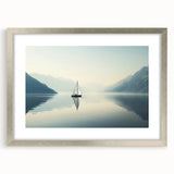 Abstract art print of a stylized sailboat in silver frame, using cool blue and gray tones.