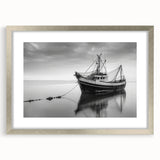 Abstract art print of a sailboat in muted blue and white tones on a silver-framed canvas, ideal for dining room decor.
