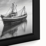 Framed canvas featuring a textured, colorful sailboat design on a black background.