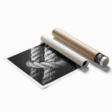 Rolled print of a sailboat on calm seas in muted blue and white tones, suitable for classy bathroom wall art.