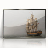Art deco style poster of a vintage ship, framed in silver acrylic, with muted blue and gray tones.