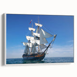 Framed canvas depicting a vintage black ship on a muted gray ocean, ideal for bedroom wall art.
