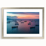 Abstract art print of a stylized ship in cool blue and gray tones on a silver-framed canvas, suitable for dining room decor.