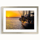 Abstract art print of a stylized boat in blues and grays on framed canvas, suitable for dining room or bedroom.